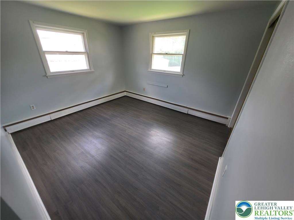 719 Keystone Avenue Bethlehem, PA 18018 - Photo 14 of 32 Laminate flooring adds modern flair to this naturally illuminated, spacious room.