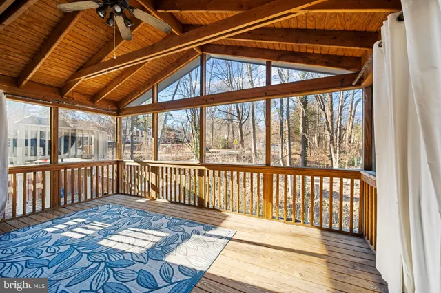 a view of a chair and table on the deck