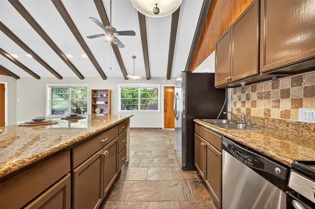a kitchen with granite countertop lots of counter top space