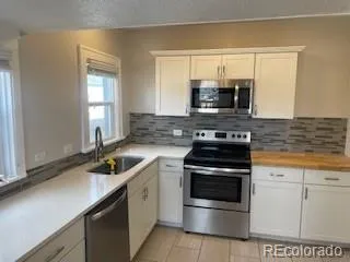 a kitchen with a stove and a sink