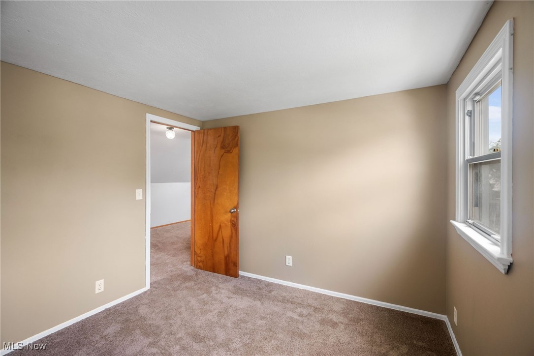 5618 Ackley Road Cleveland, OH 44129 - Photo 26 of 38 Spare room featuring light carpet