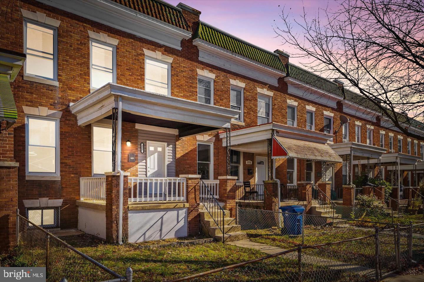 327 Lyndhurst Street Baltimore, MD 21229 - Photo 2 of 44 a view of a brick house with many windows