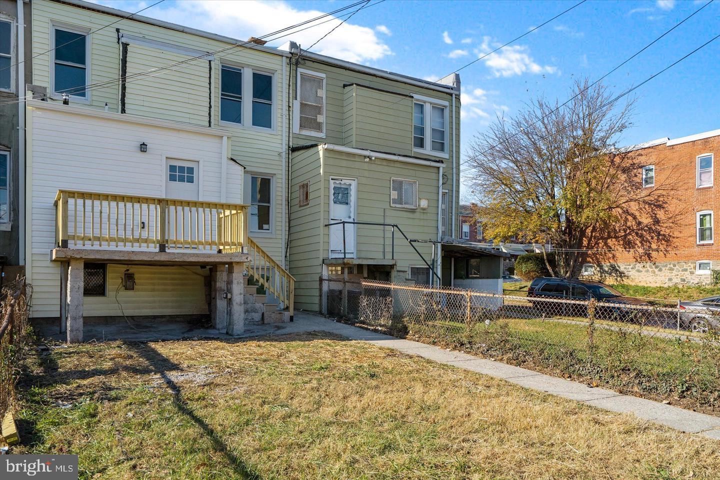 327 Lyndhurst Street Baltimore, MD 21229 - Photo 43 of 44 a front view of a house with a yard