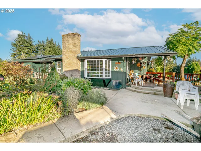 a front view of a building with garden
