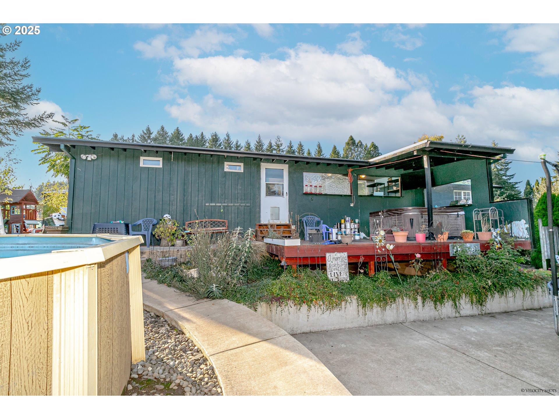 38289 Southeast Coupland Road Estacada, OR 97023 - Photo 30 of 48 a view of a chair and tables in the patio next to a yard