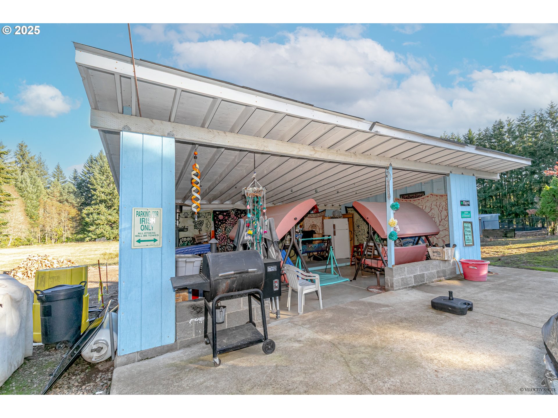 38289 Southeast Coupland Road Estacada, OR 97023 - Photo 33 of 48 a view of a patio with table and chairs under an umbrella