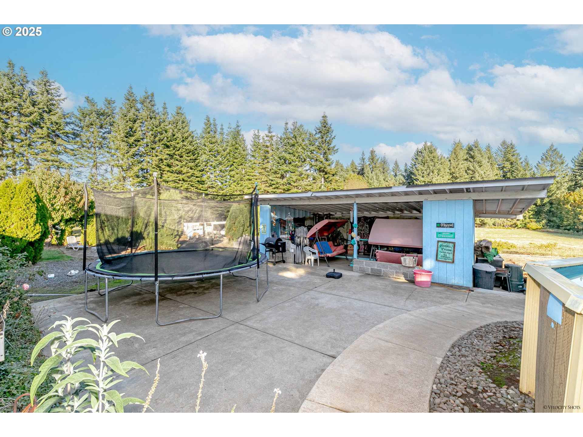 38289 Southeast Coupland Road Estacada, OR 97023 - Photo 34 of 48 a view of a chairs and table in the patio and a fountain