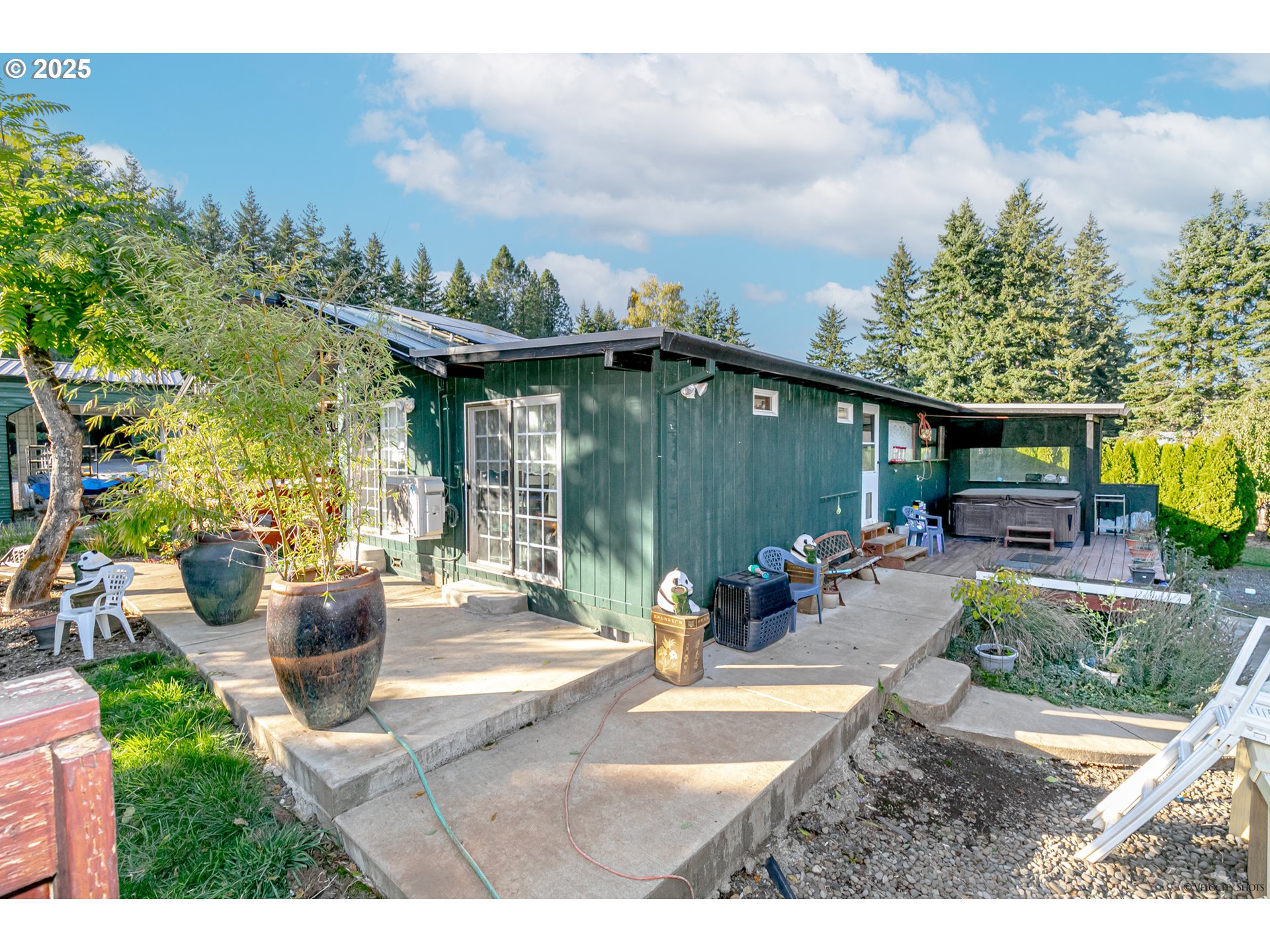 38289 Southeast Coupland Road Estacada, OR 97023 - Photo 35 of 48 a view of a patio with couches table and chairs and potted plants