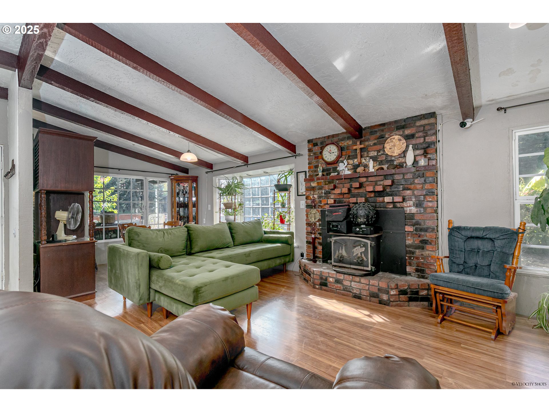 38289 Southeast Coupland Road Estacada, OR 97023 - Photo 6 of 48 a living room with furniture a fireplace and a flat screen tv