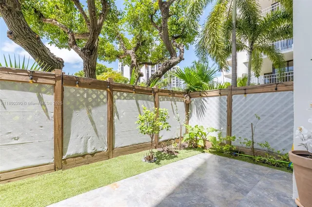 a view of a backyard with a garden