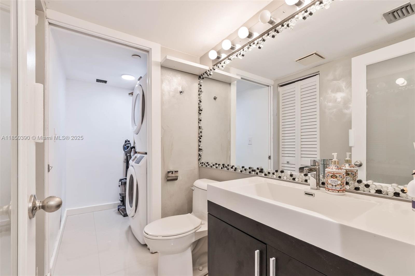 1000 Quayside Terrace, Unit 308 Miami, FL 33138 - Photo 18 of 28 a bathroom with a sink toilet and shower