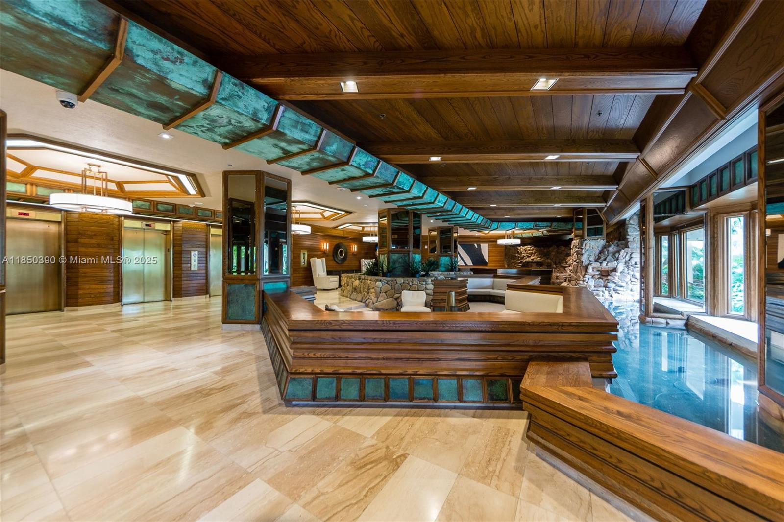 1000 Quayside Terrace, Unit 308 Miami, FL 33138 - Photo 26 of 28 a view of fountain with a table and chairs