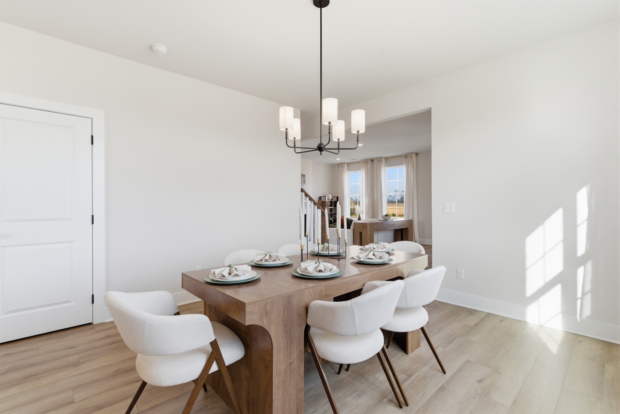 1809 Flatwaters Street Spring Hill, TN 37174 - Photo 11 of 27 a view of a dining room with furniture wooden floor and chandelier