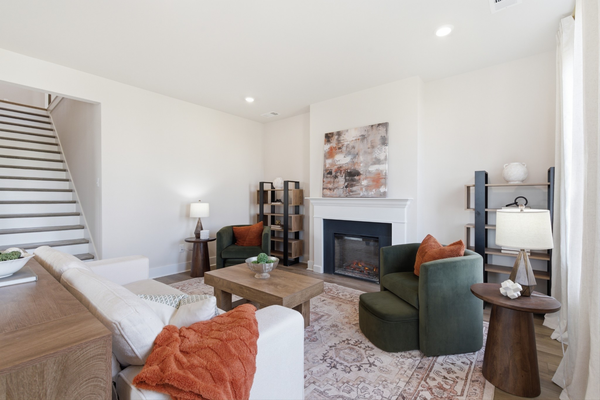 1809 Flatwaters Street Spring Hill, TN 37174 - Photo 14 of 27 a living room with furniture and a fireplace