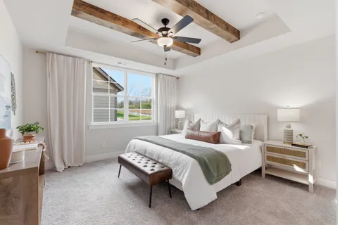 a bedroom with a bed furniture and a window