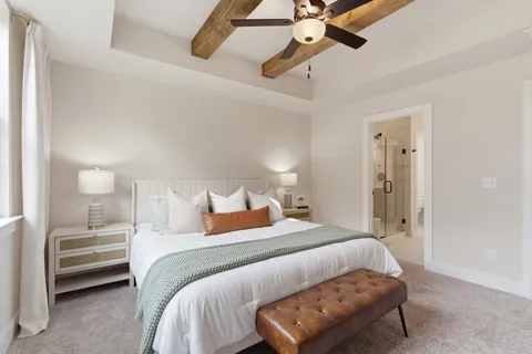 a bedroom with a bed and a couch