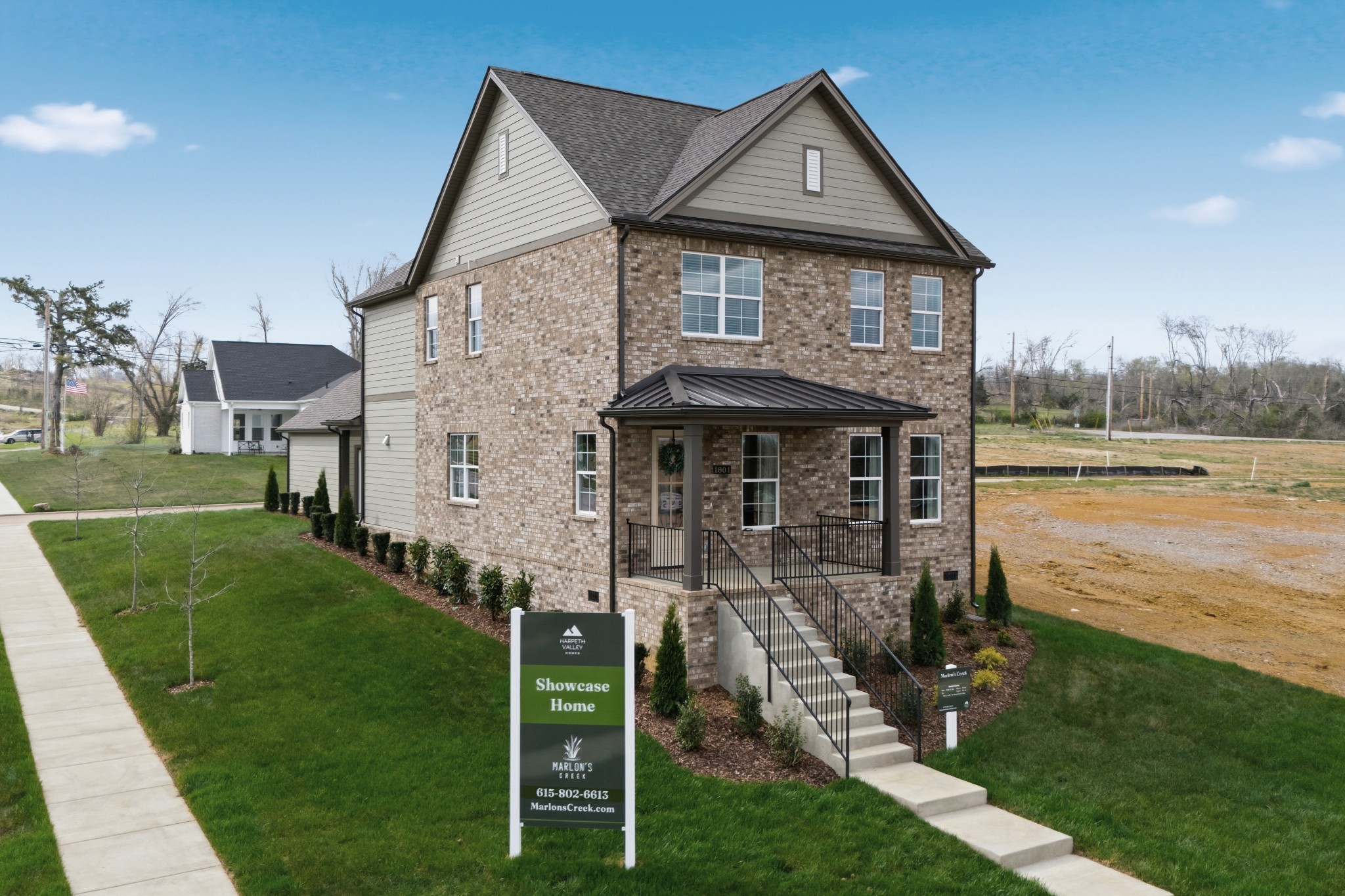 1809 Flatwaters Street Spring Hill, TN 37174 - Photo 2 of 27 a front view of a house with garden