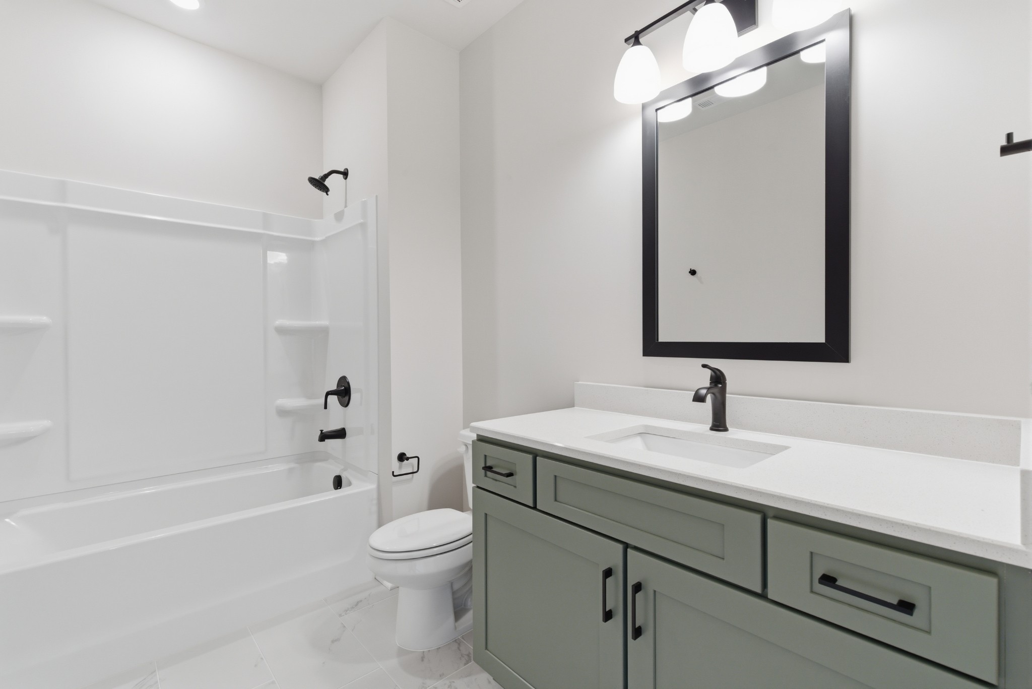 1809 Flatwaters Street Spring Hill, TN 37174 - Photo 24 of 27 a bathroom with a sink a toilet and a mirror