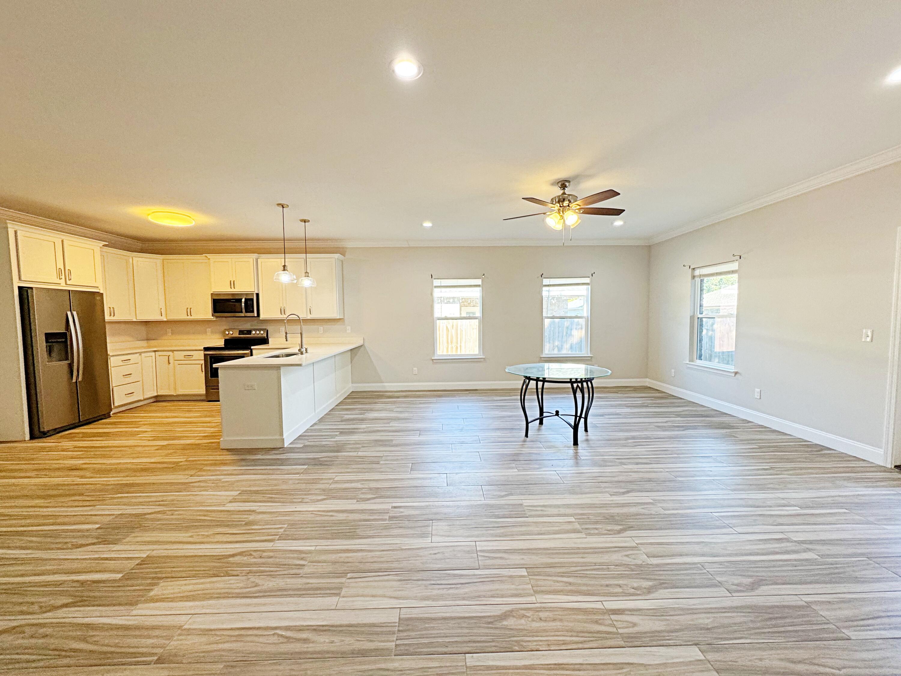 420 Little John Road Mary Esther, FL 32569 - Photo 13 of 37 a view of kitchen with cabinets and wooden floor