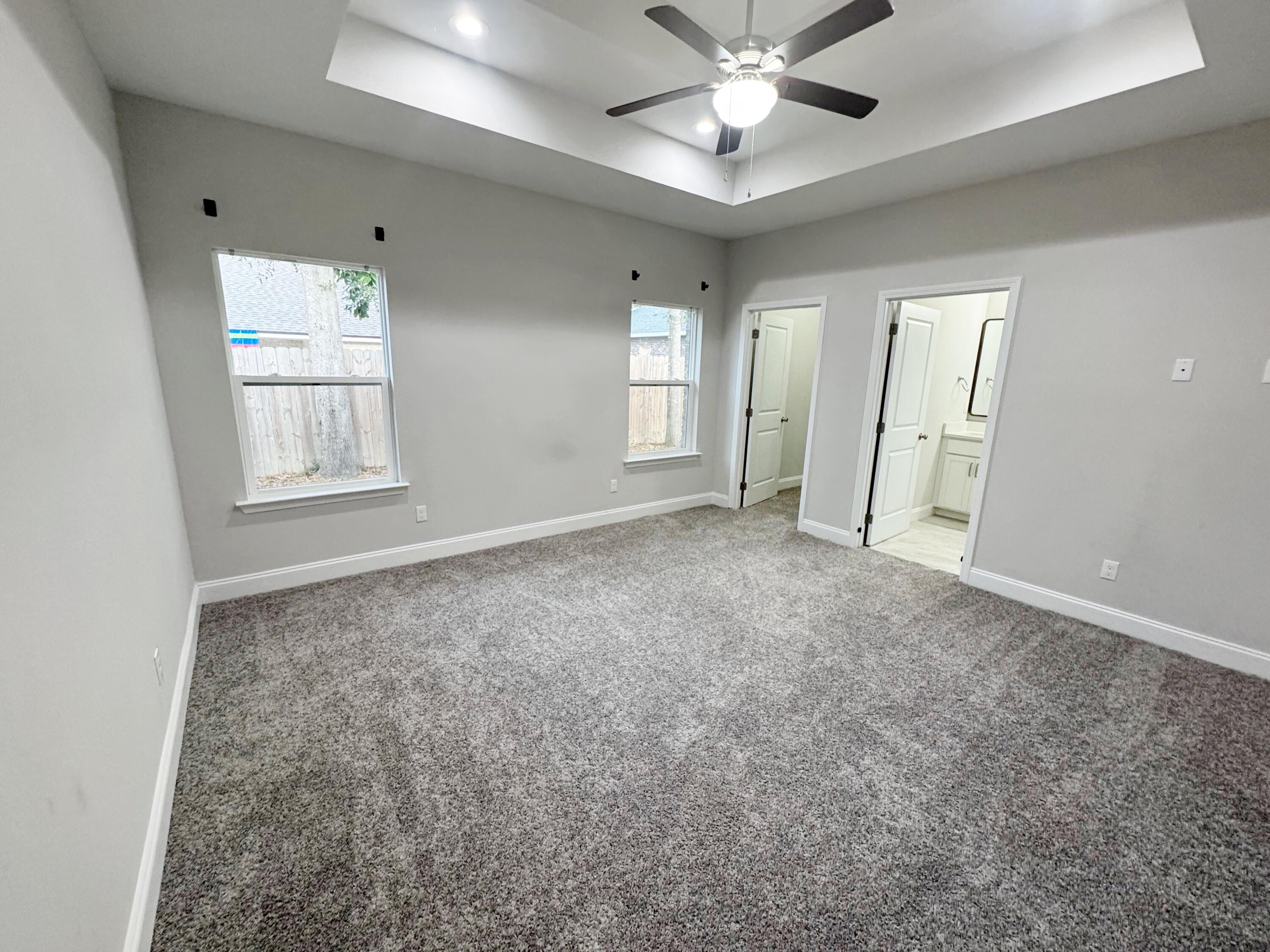 420 Little John Road Mary Esther, FL 32569 - Photo 18 of 37 an empty room with windows and fan