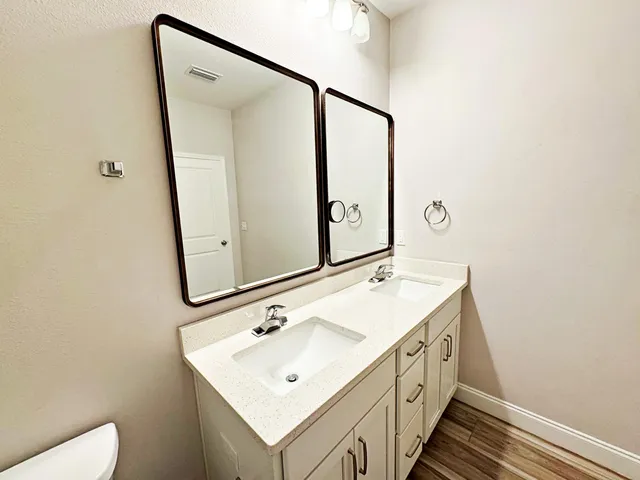 a bathroom with a sink and mirror
