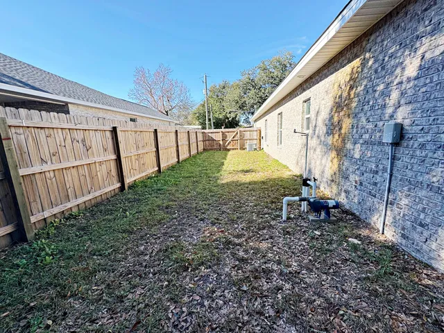 a view of backyard with green space