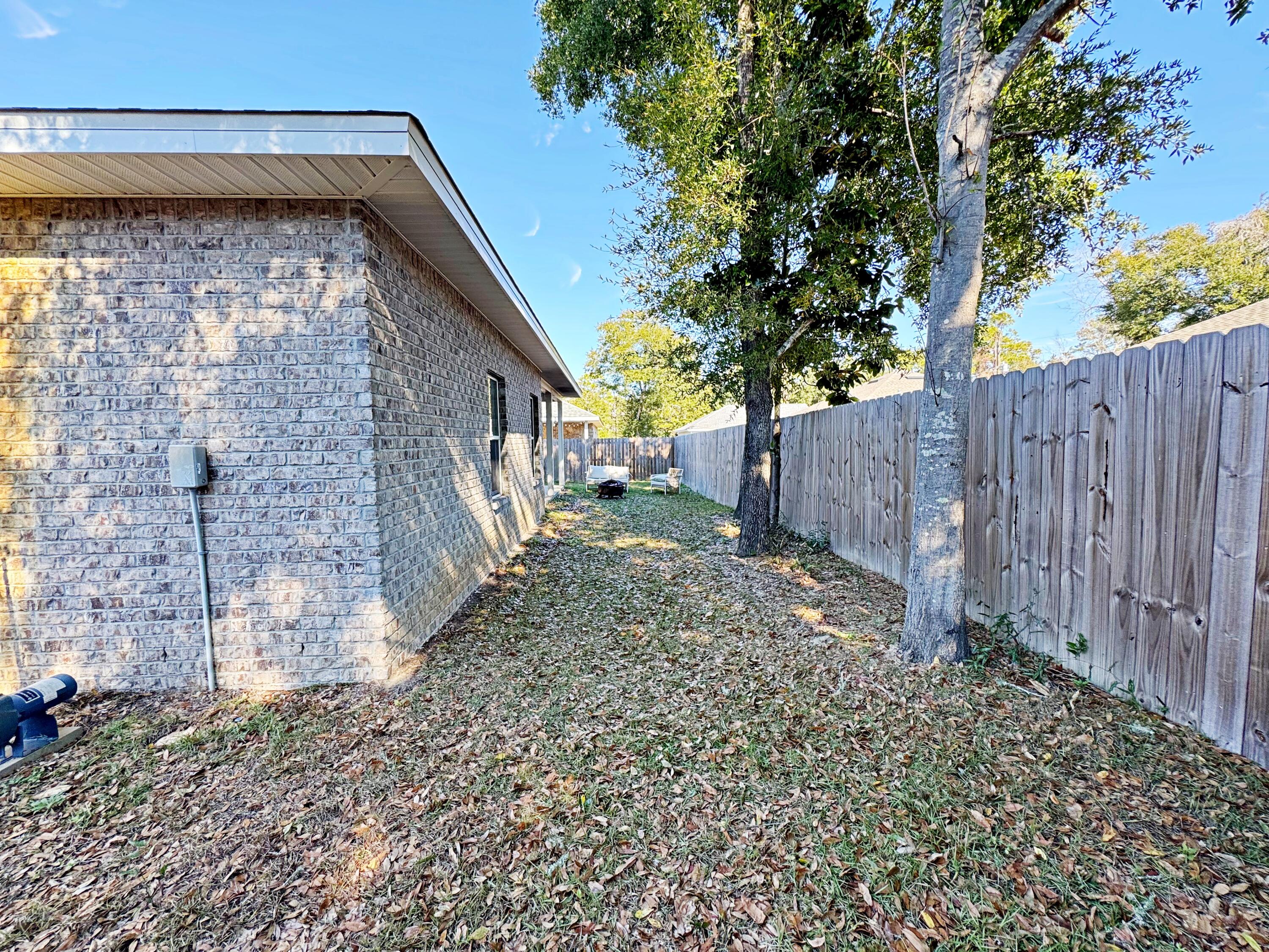 420 Little John Road Mary Esther, FL 32569 - Photo 33 of 37 a backyard of a house