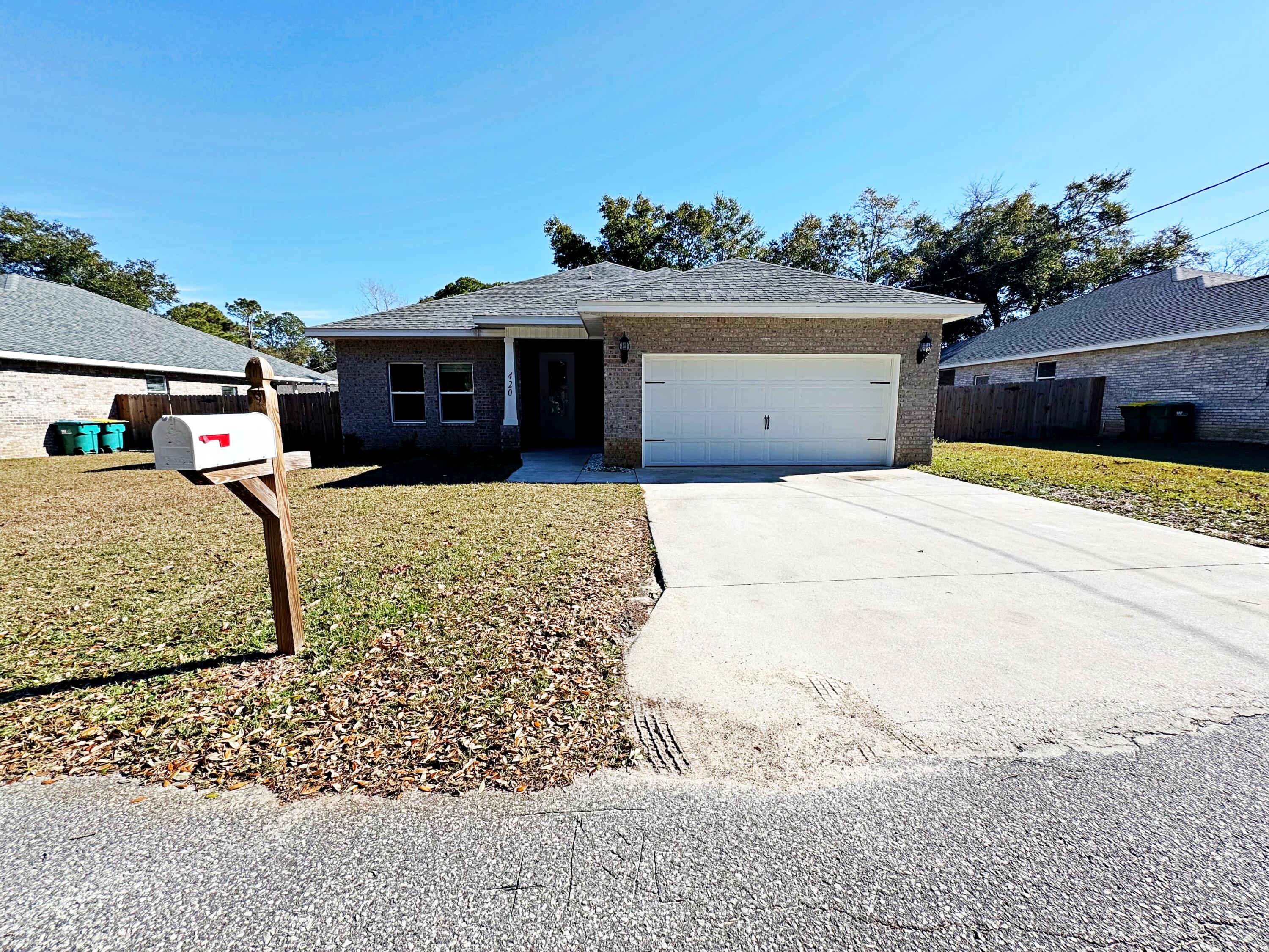 420 Little John Road Mary Esther, FL 32569 - Photo 8 of 37 a front view of a house with a yard