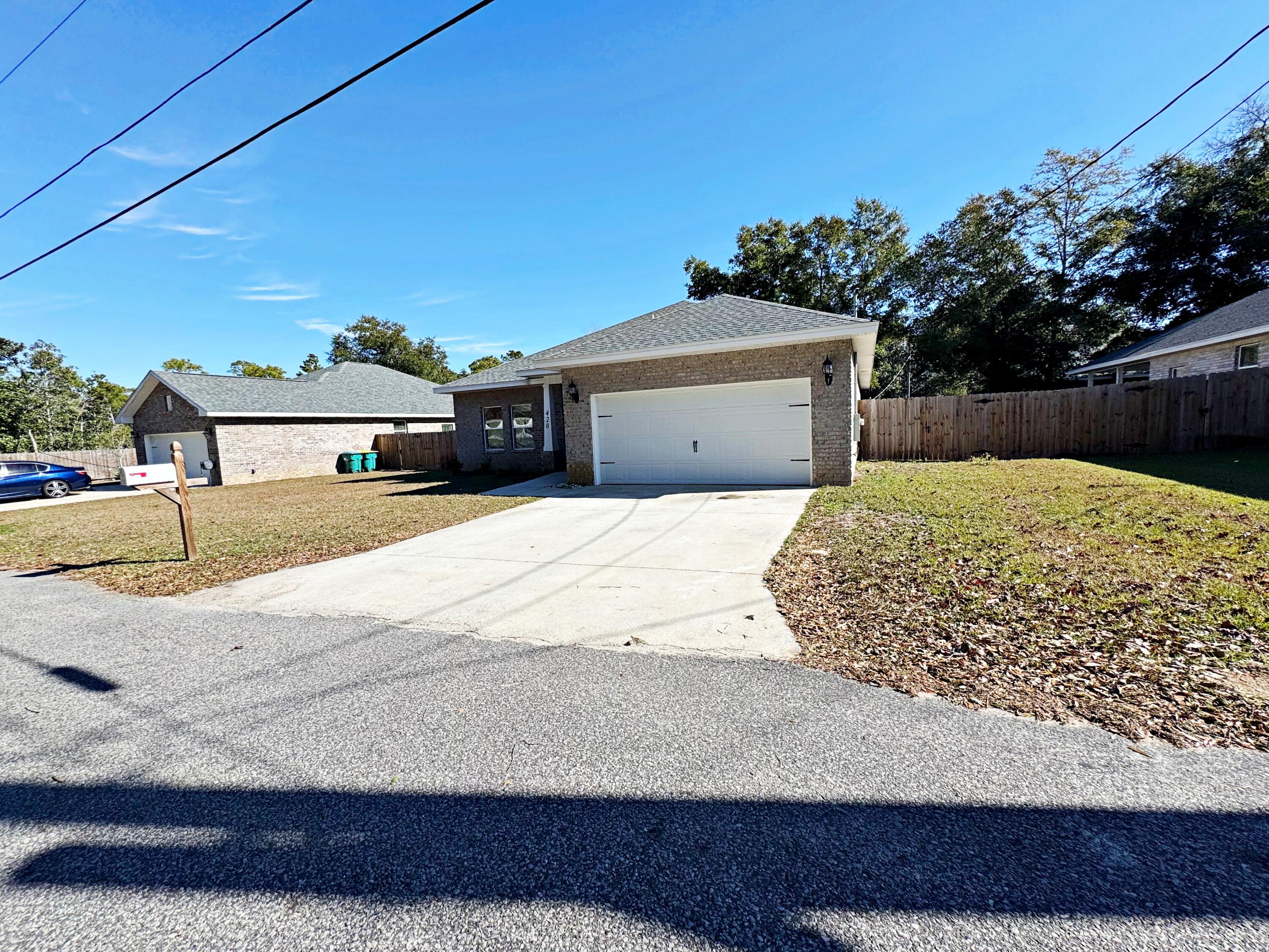 420 Little John Road Mary Esther, FL 32569 - Photo 9 of 37 a view of a house with a snow on the road