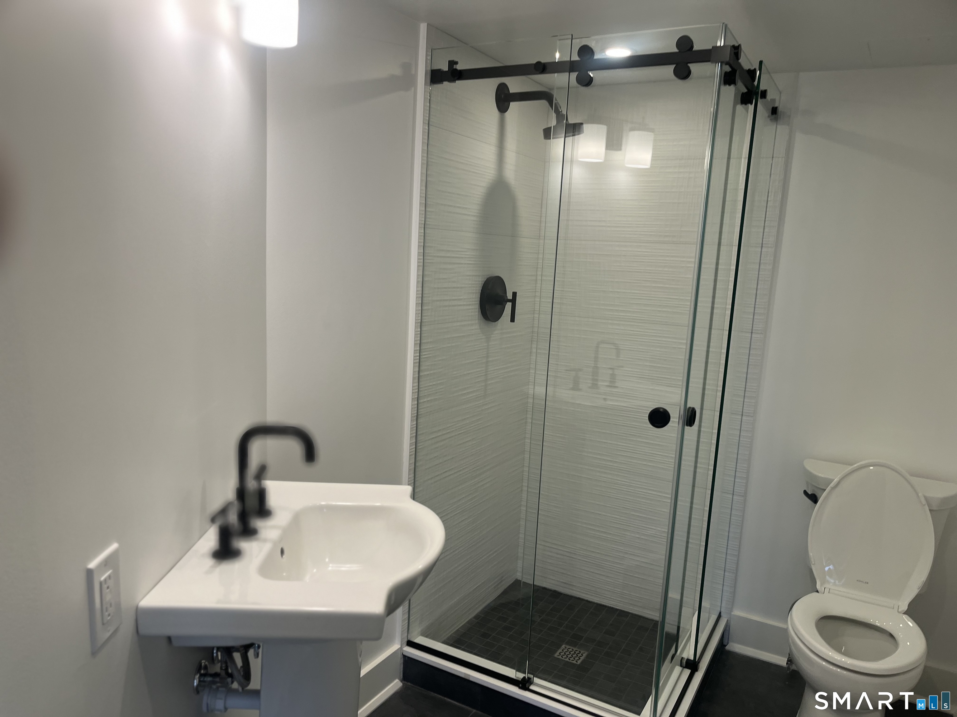 25 Forest Street, Unit 7K Stamford, CT 06901 - Photo 11 of 15 a bathroom with a sink toilet and shower