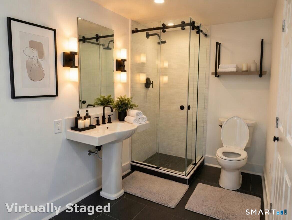 25 Forest Street, Unit 7K Stamford, CT 06901 - Photo 10 of 15 a bathroom with a sink toilet and shower