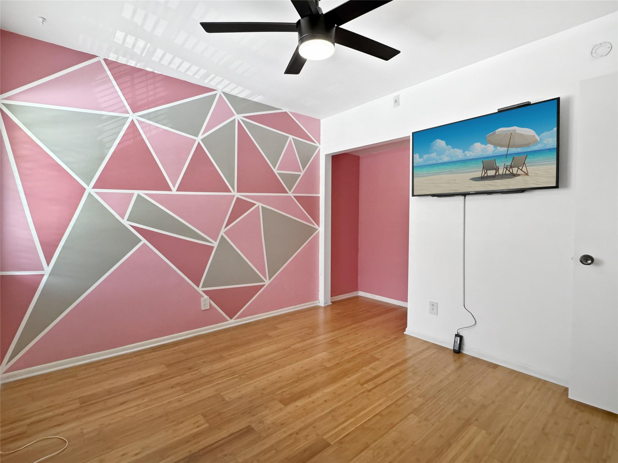 128 South Cypress Road, Unit 823 Pompano Beach, FL 33060 - Photo 17 of 23 a view of an empty room with wooden floor