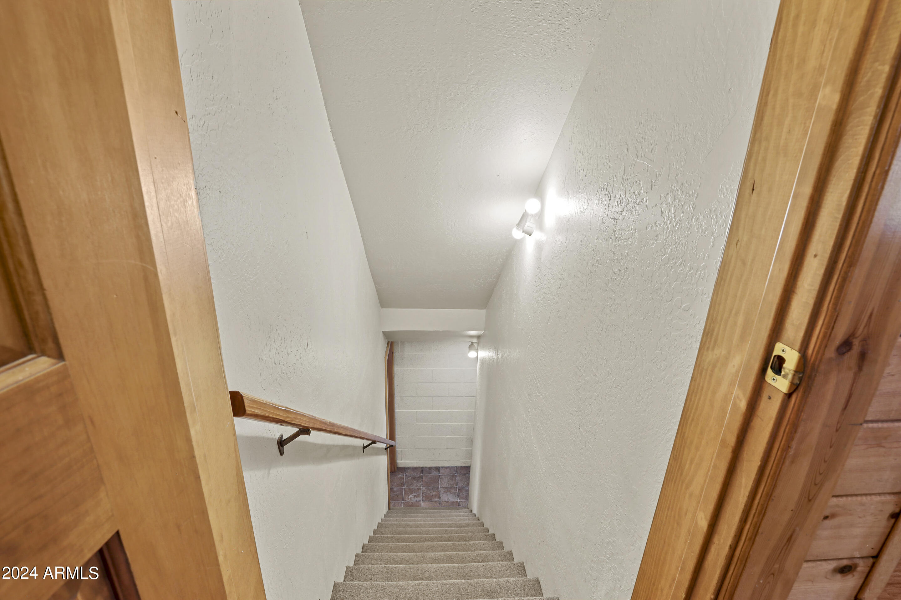4758 Rim View Loop Strawberry, AZ 85544 - Photo 21 of 40 a view of a hallway with staircase
