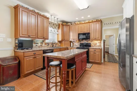 a view of a garden with a table and chairs