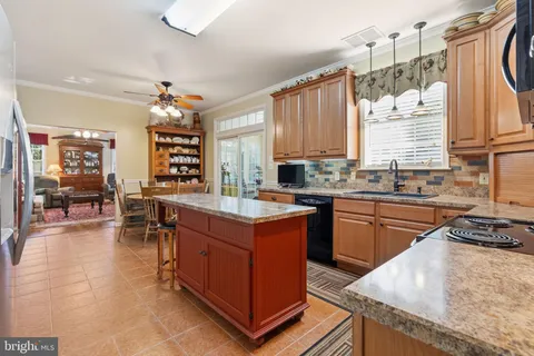 a pathway of a house with a yard