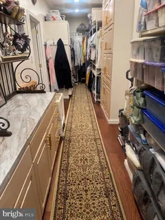 a backyard of a house with fountain table and chairs potted plants