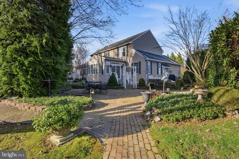 a view of a livingroom with workspace and a window