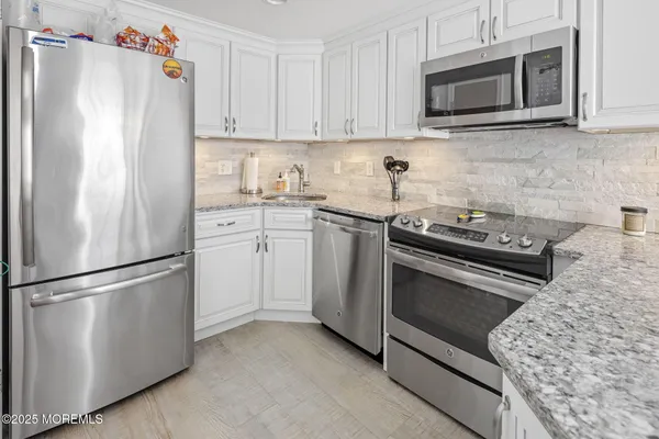 a kitchen with a table and chairs