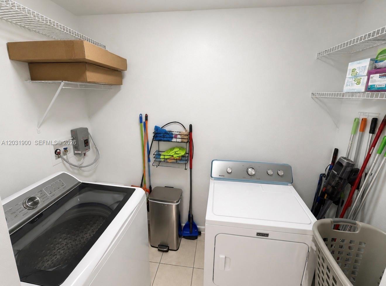 12860 Southwest 43rd Drive, Unit 146B Miami, FL 33175 - Photo 7 of 12 a utility room with dryer and washer