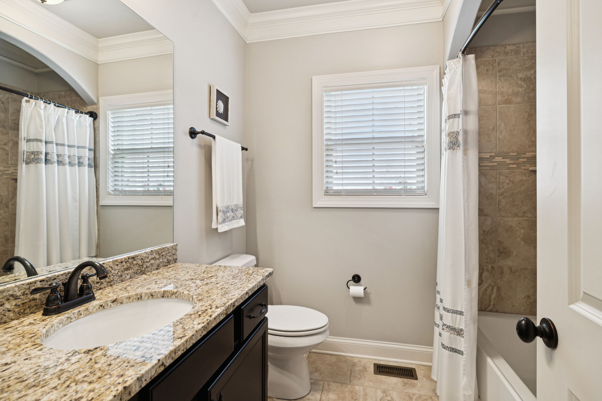 8009 June Apple Lane Spring Hill, TN 37174 - Photo 32 of 69 a bathroom with a granite countertop sink toilet and shower