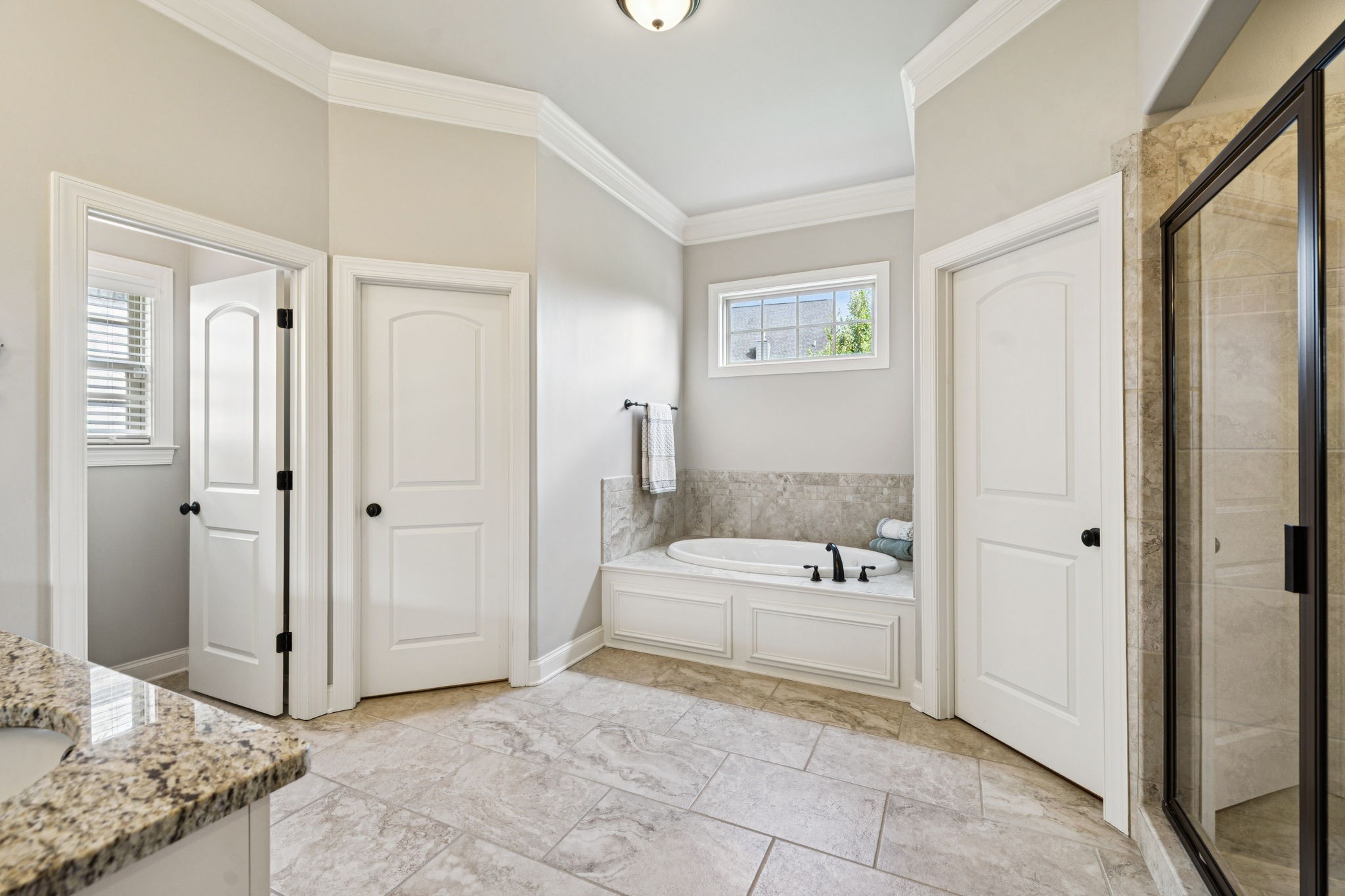 8009 June Apple Lane Spring Hill, TN 37174 - Photo 36 of 69 a bathroom with a tub shower and a sink