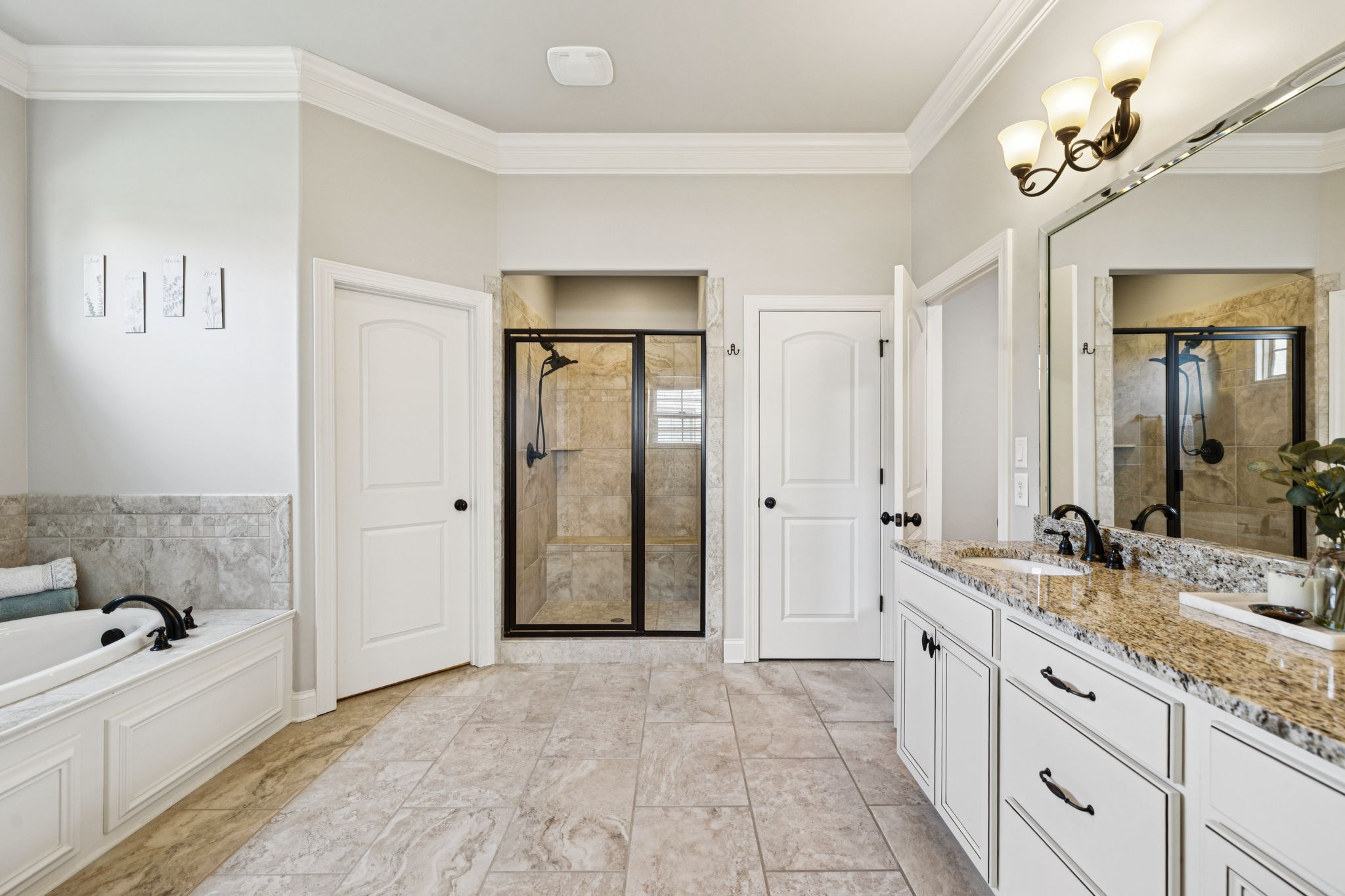 8009 June Apple Lane Spring Hill, TN 37174 - Photo 37 of 69 a spacious bathroom with a tub sink and mirror