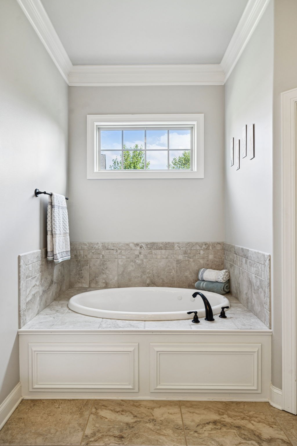 8009 June Apple Lane Spring Hill, TN 37174 - Photo 38 of 69 a bathroom with a bathtub and a window