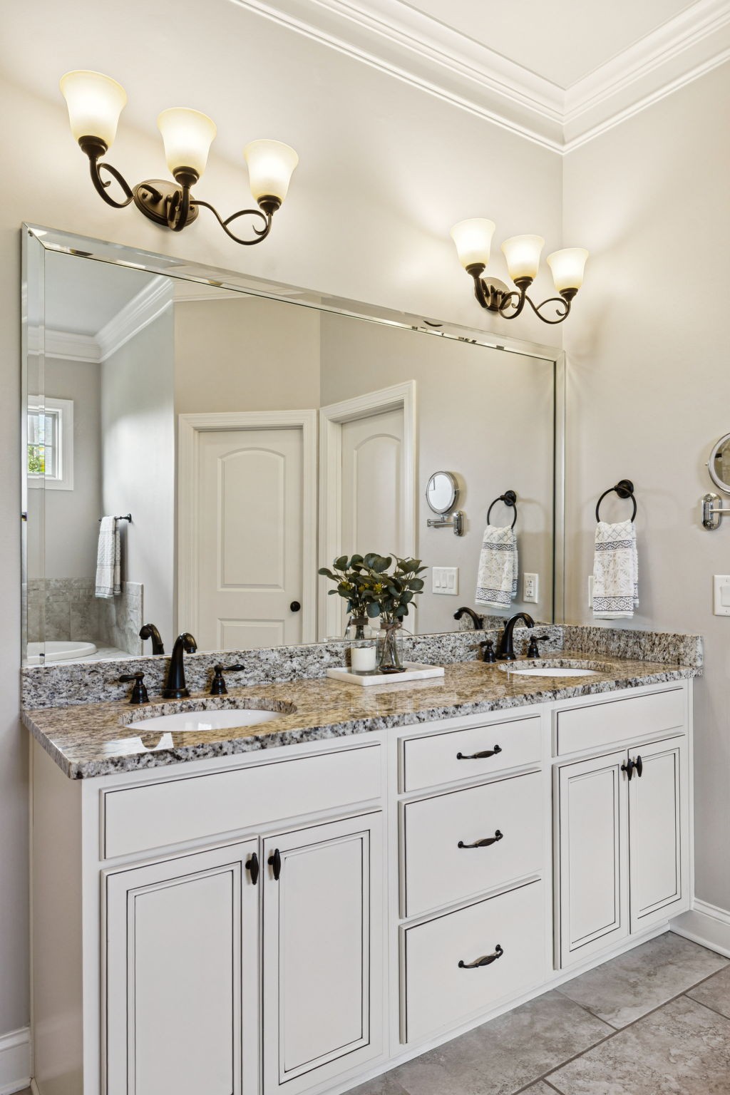 8009 June Apple Lane Spring Hill, TN 37174 - Photo 40 of 69 a bathroom with a granite countertop sink and a mirror