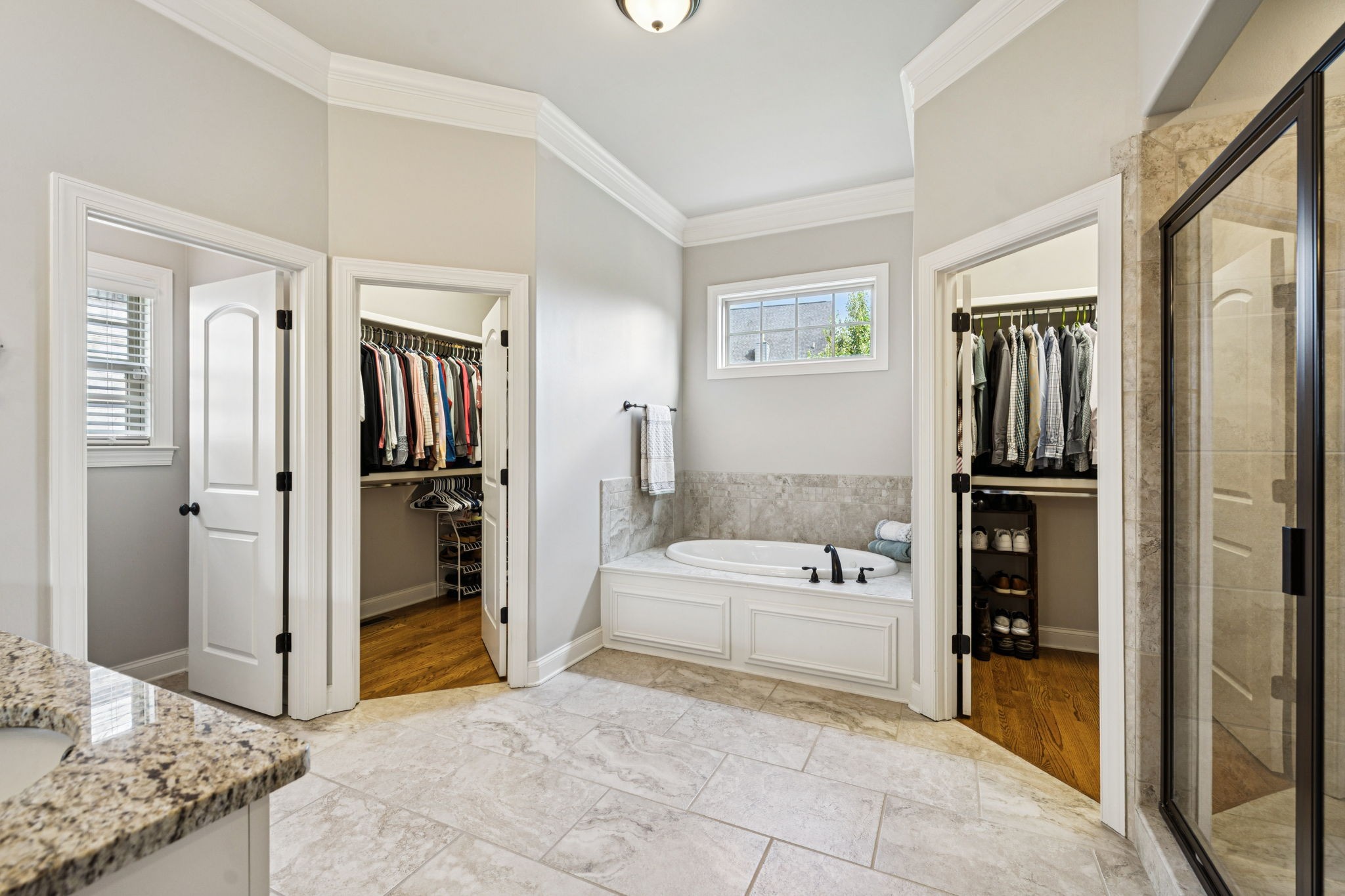 8009 June Apple Lane Spring Hill, TN 37174 - Photo 41 of 69 a en suite spacious bathroom with a tub shower and hallway