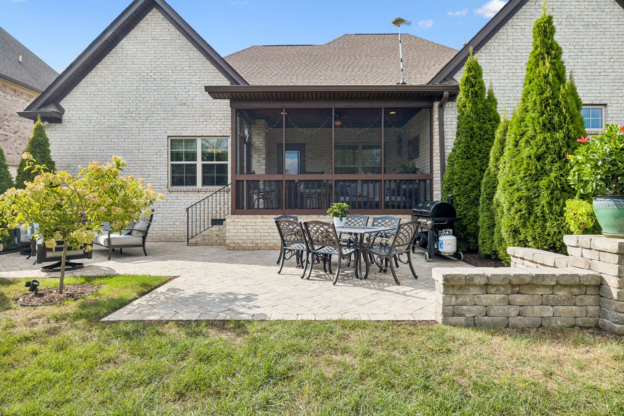 8009 June Apple Lane Spring Hill, TN 37174 - Photo 63 of 69 a view of a patio with table and chairs and potted plants