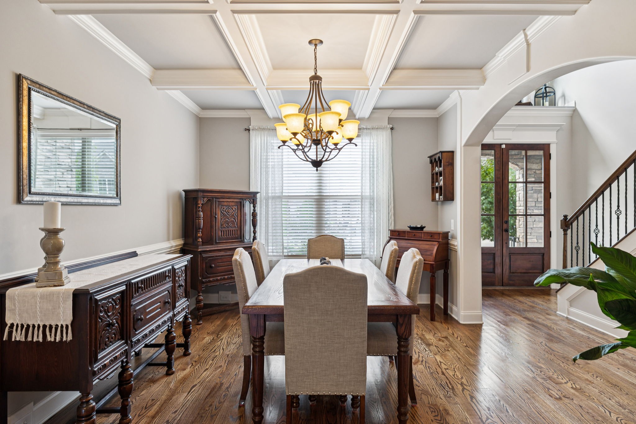 8009 June Apple Lane Spring Hill, TN 37174 - Photo 10 of 69 a view of a dining room with furniture a chandelier and wooden floor