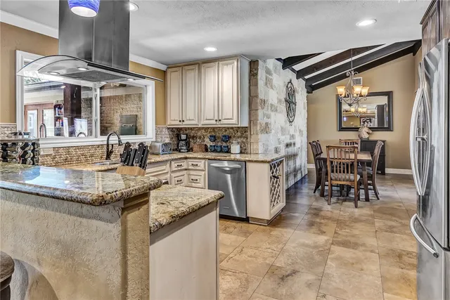 a kitchen with counter top space appliances and cabinets