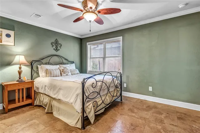 a bedroom with a bed and window