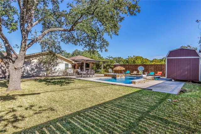 a view of a swimming pool with a patio